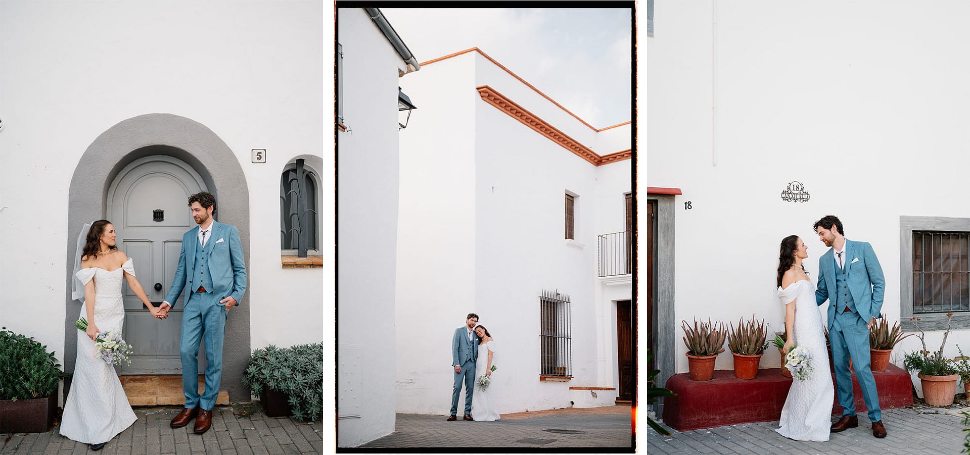 Newlywed couple in blue suits and white dresses holding hands outside white buildings - Intimate Wedding at Masia Victoria
