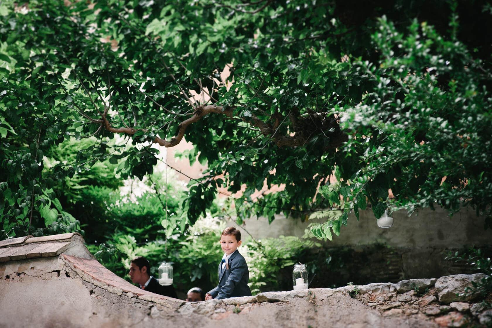 Young boy in suit at a wedding villa in Sitges - Barcelona Wedding Photographer