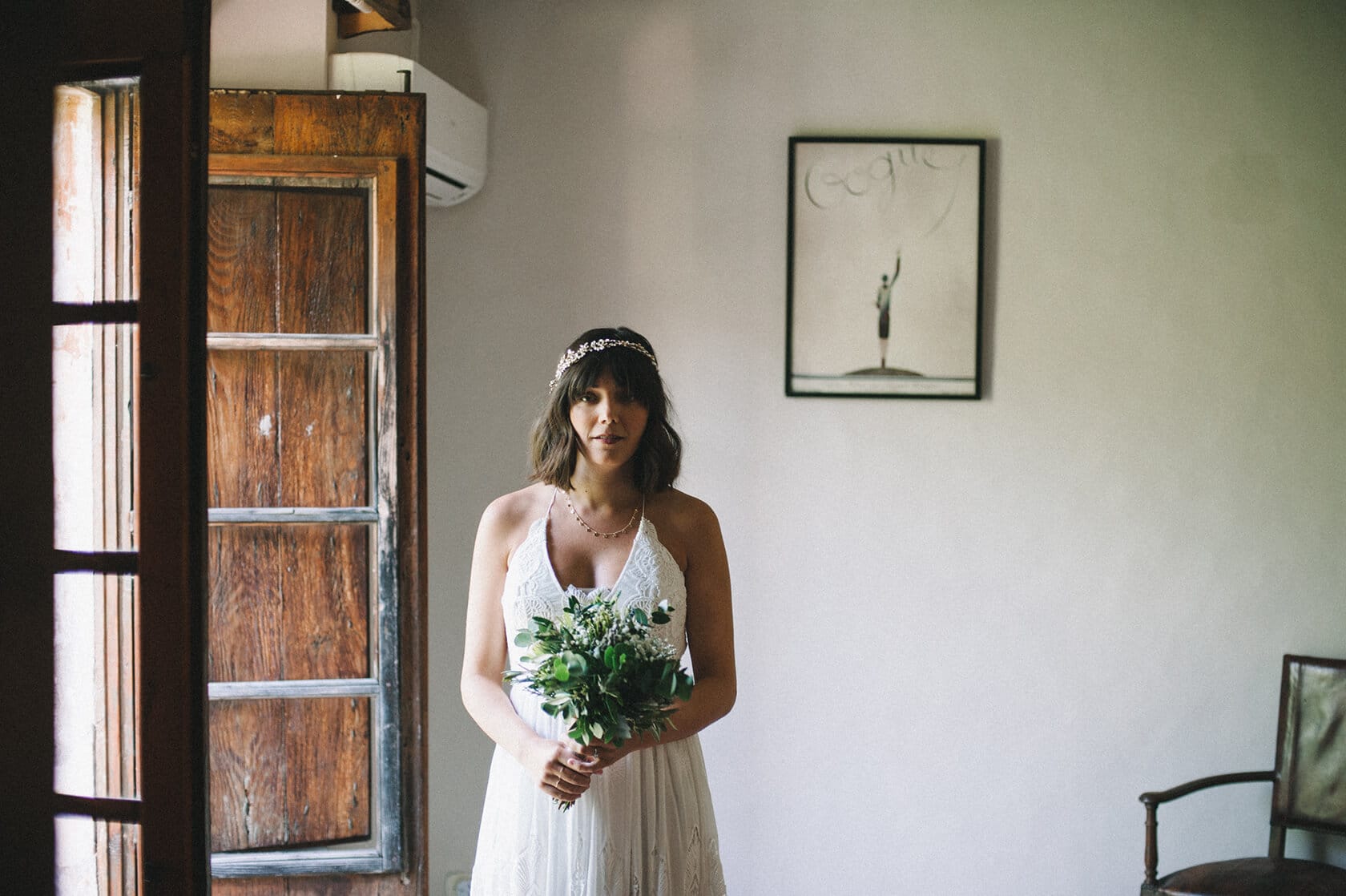 Bride in a white dress holding a bouquet at Villa Almanita, Sitges destination wedding. - Barcelona Wedding Photographer