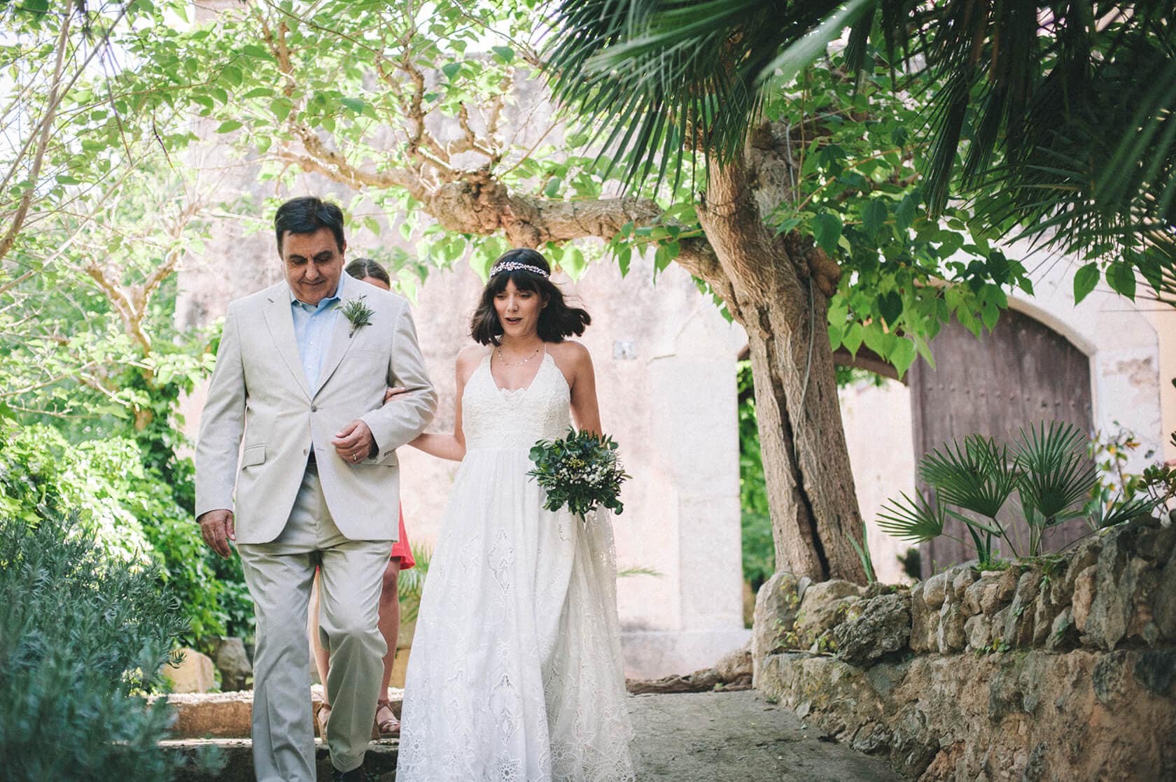 Bride and father walking down steps at Villa Almanita, Sitges destination wedding. - Barcelona Wedding Photographer
