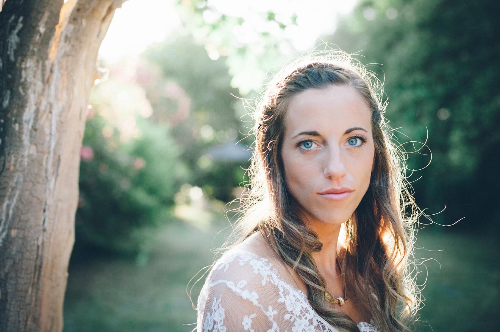 Bride with blue eyes and lace dress in natural light, wedding photographer Barcelona - Barcelona Wedding Photographer