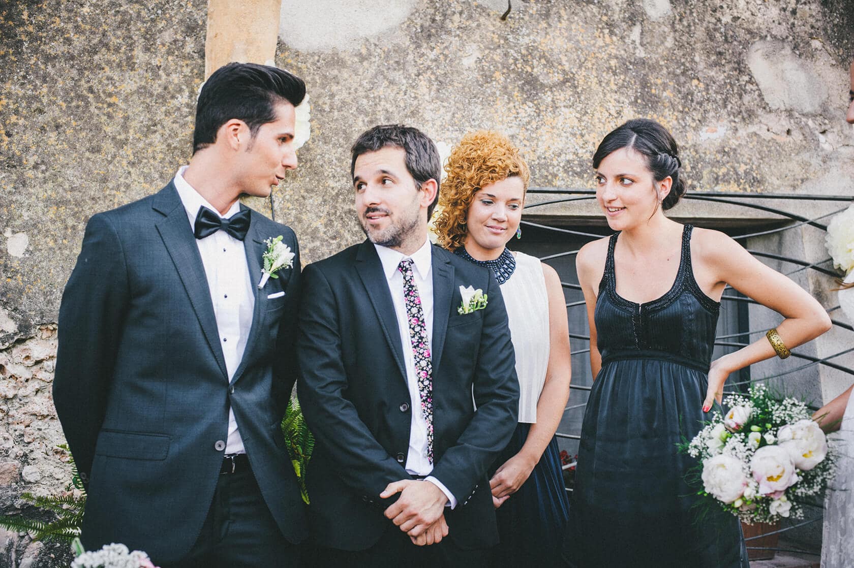 Wedding party in Barcelona: groom, bride, and guests posing for a wedding photographer. - Barcelona Wedding Photographer