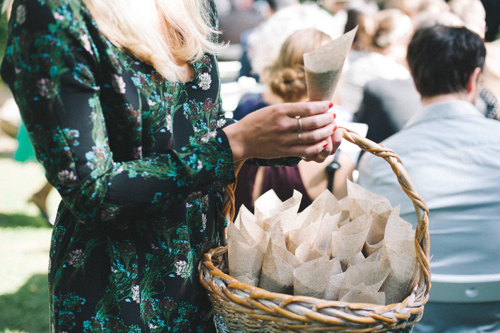 Bride holding confetti cones at Villa Almanita, Sitges destination wedding - Barcelona Wedding Photographer