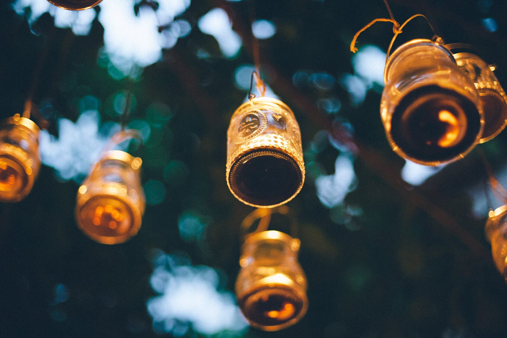 Glass jar lanterns hanging at Villa Almanita for Clara & Toph's destination wedding in Sitges. - Barcelona Wedding Photographer