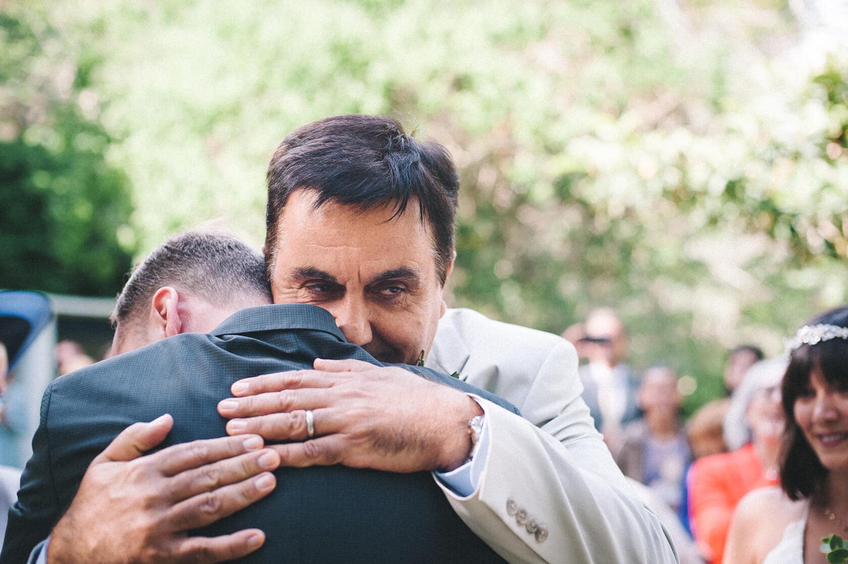 Groom hugs father at a destination wedding villa in Sitges - Barcelona Wedding Photographer