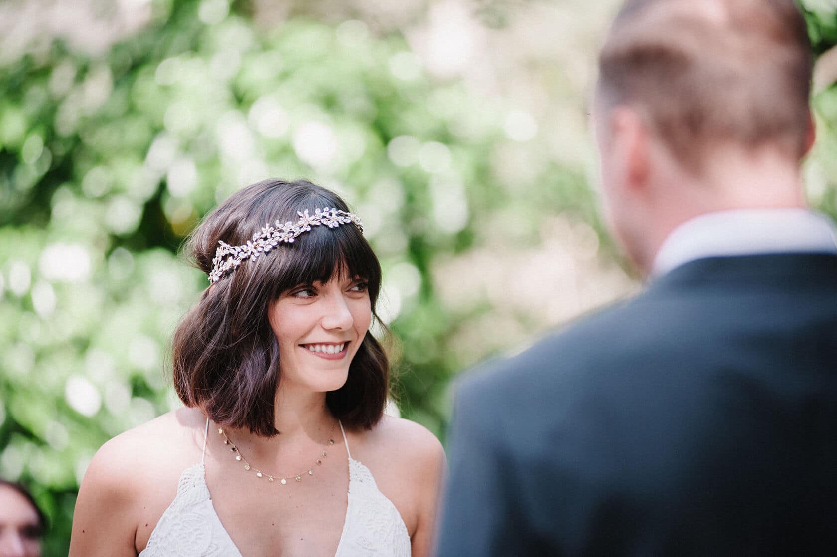 Bride smiling at groom at Villa Almanita destination wedding in Sitges. - Barcelona Wedding Photographer