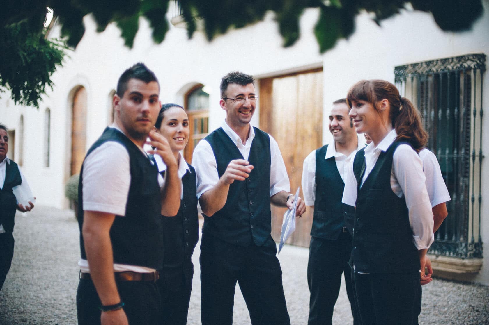 Wedding staff in uniform smiling outdoors in Barcelona - Barcelona Wedding Photographer