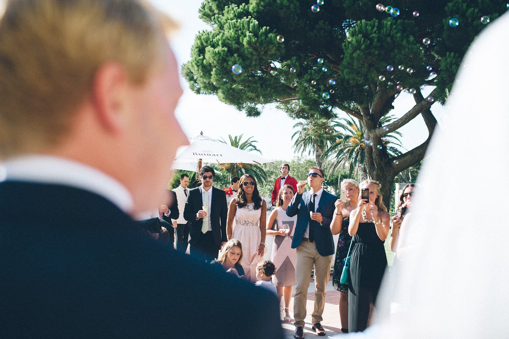 Wedding guests watch ceremony in S'Agaro, Spain - Barcelona Wedding Photographer