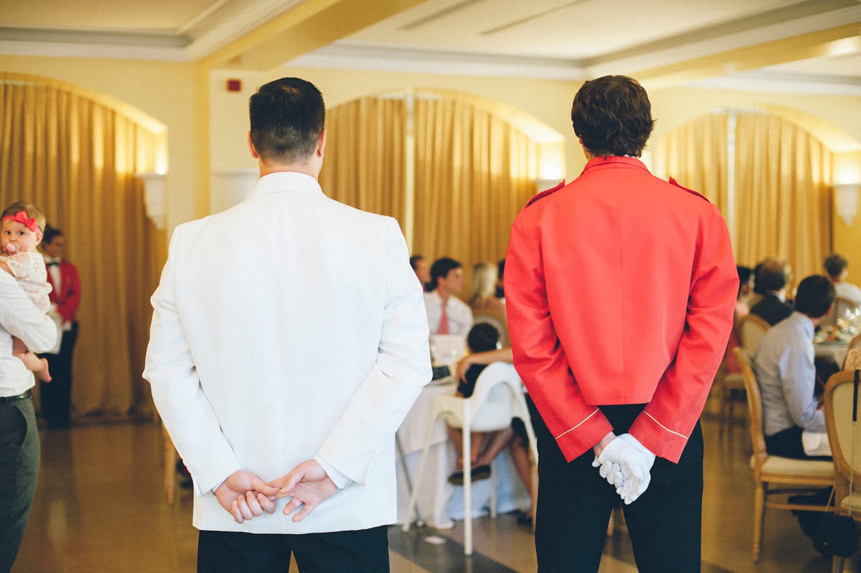 Wedding photographer captures attendants in red and white jackets at Tsega & Anders' S'Agaro wedding. - Barcelona Wedding Photographer