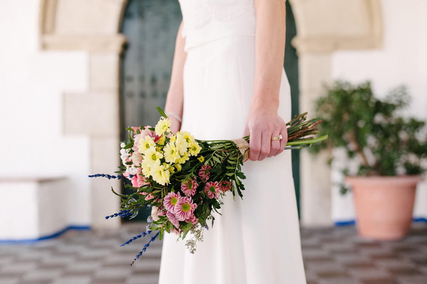 Bride holding a colorful bouquet at Casanova Estate wedding venue. - Barcelona Wedding Photographer