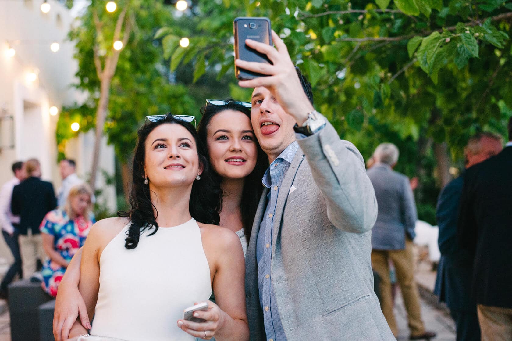 Catherine and James' wedding guests taking a selfie at Casanova Estate. - Barcelona Wedding Photographer