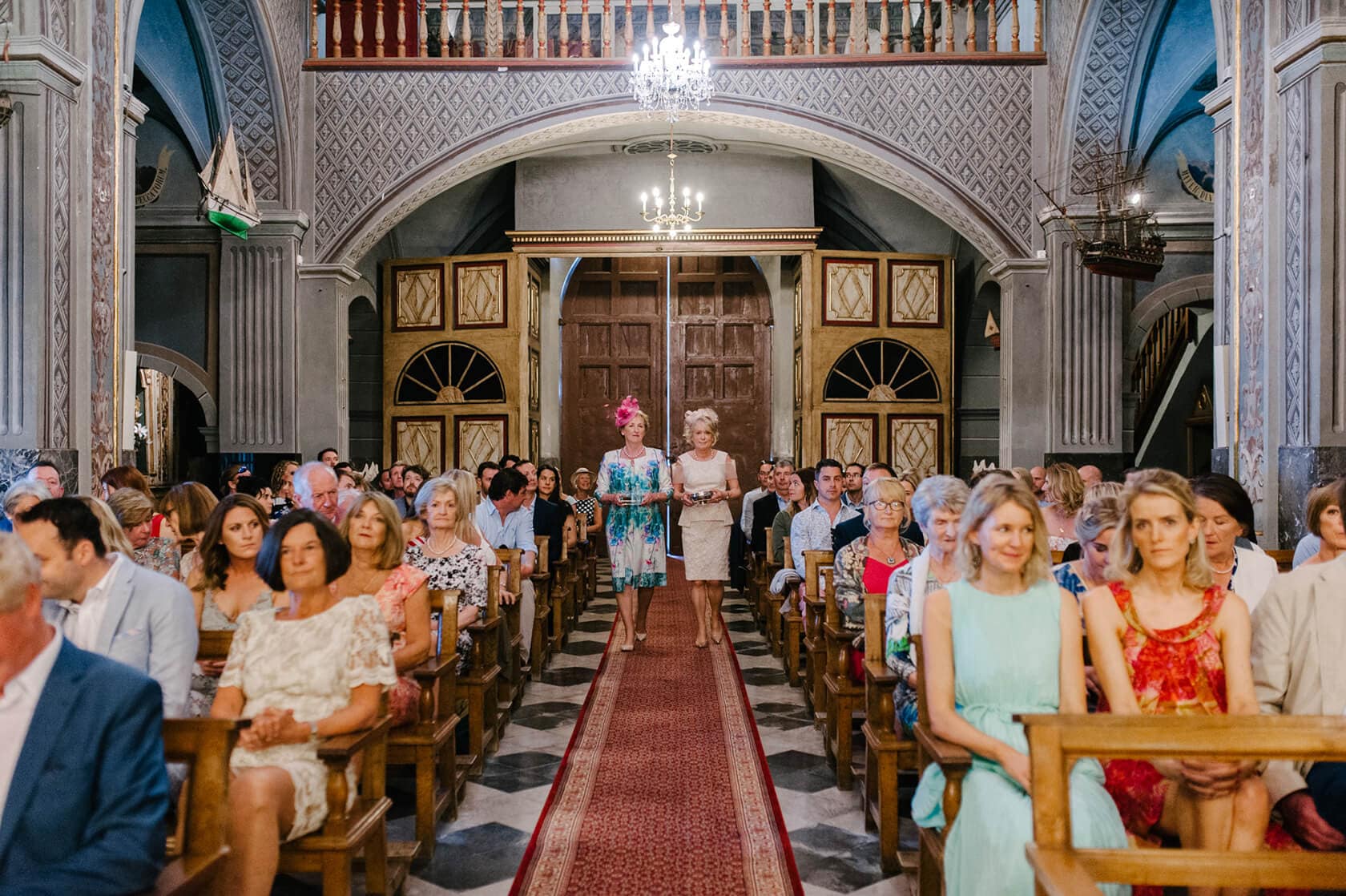 Wedding ceremony at Casanova Estate with guests seated in a church. - Barcelona Wedding Photographer