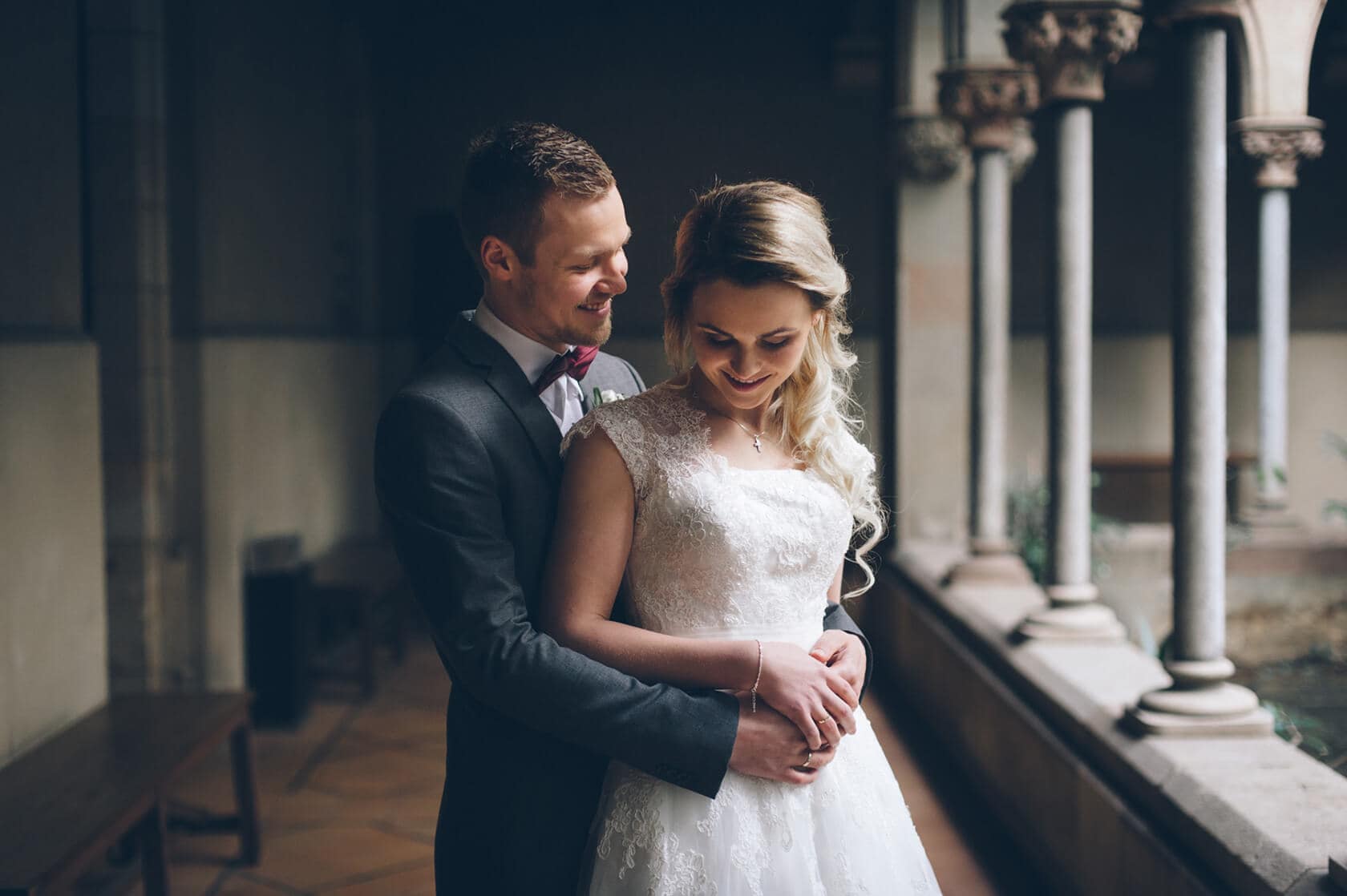 Bride and groom embrace in a historic Barcelona venue, Barcelona wedding photographer - Barcelona Wedding Photographer