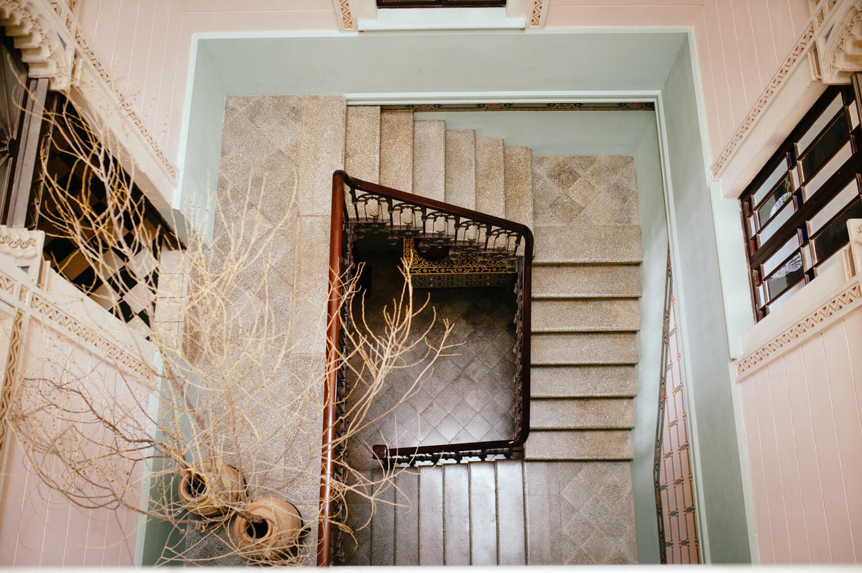 Elegant staircase in a wedding villa in Sitges with ornate railing. - Barcelona Wedding Photographer