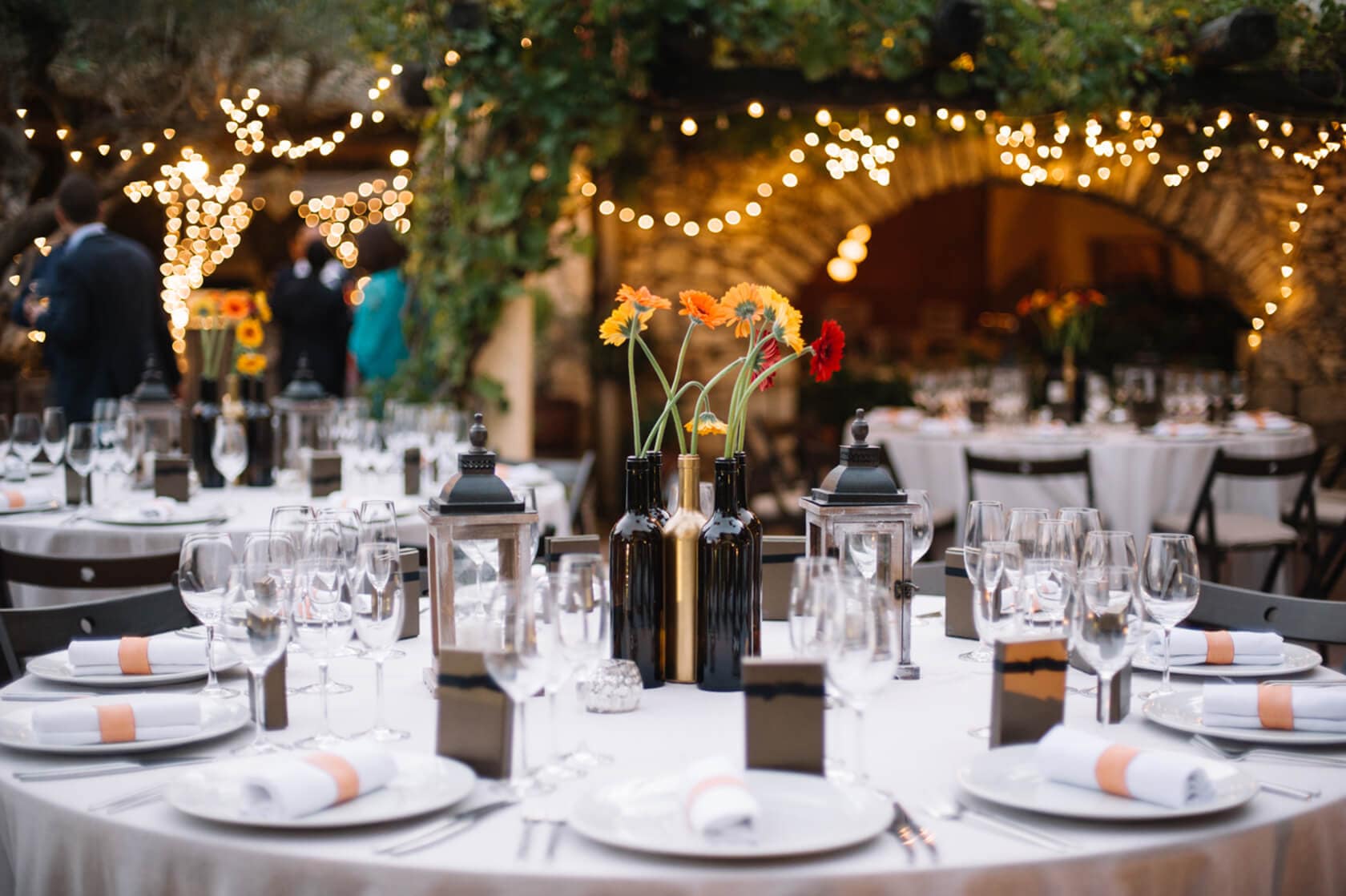 Wedding villas in Sitges: elegant table setting with string lights - Barcelona Wedding Photographer