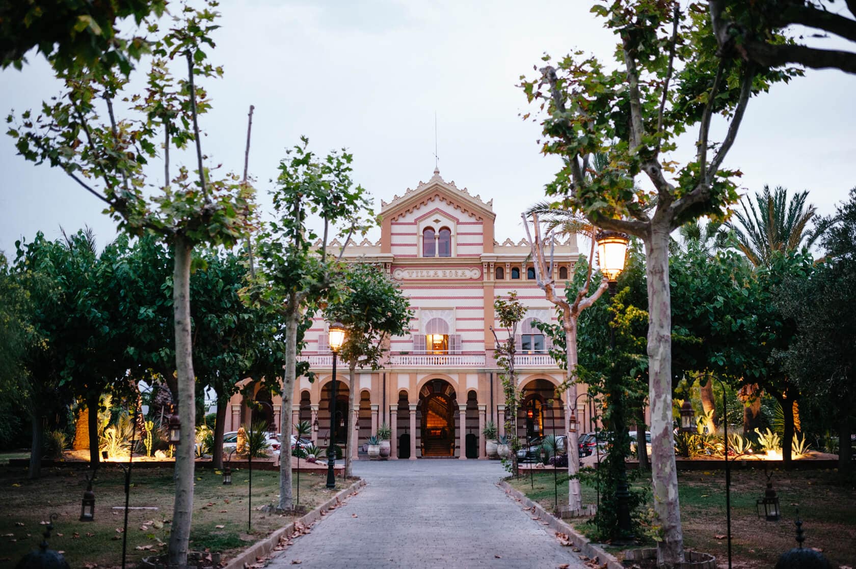 Elegant Villa Iris wedding venue in Sitges, Spain, with ornate facade and manicured gardens. - Barcelona Wedding Photographer