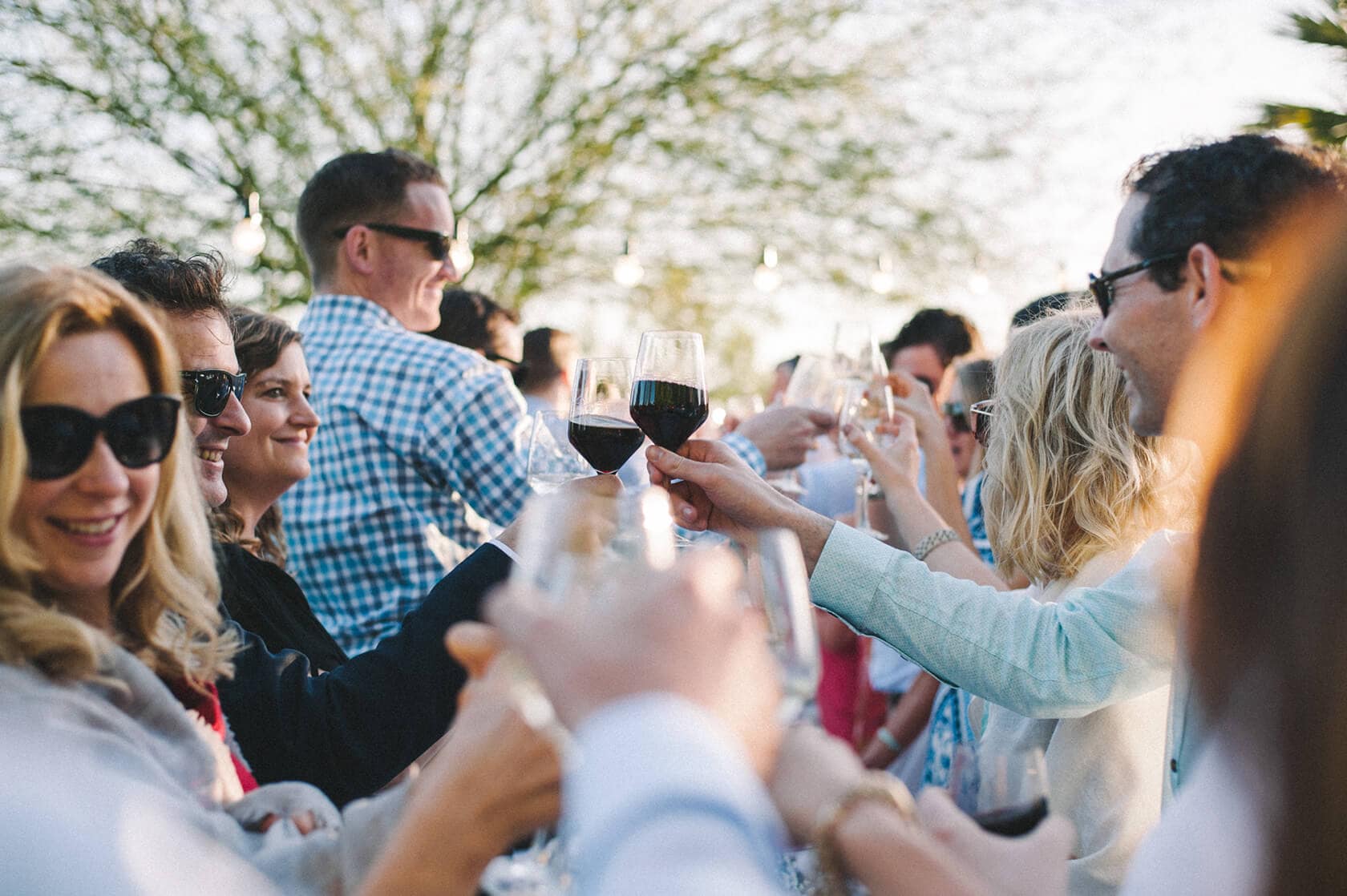Guests toasting with wine at a wedding villa in Sitges - Barcelona Wedding Photographer