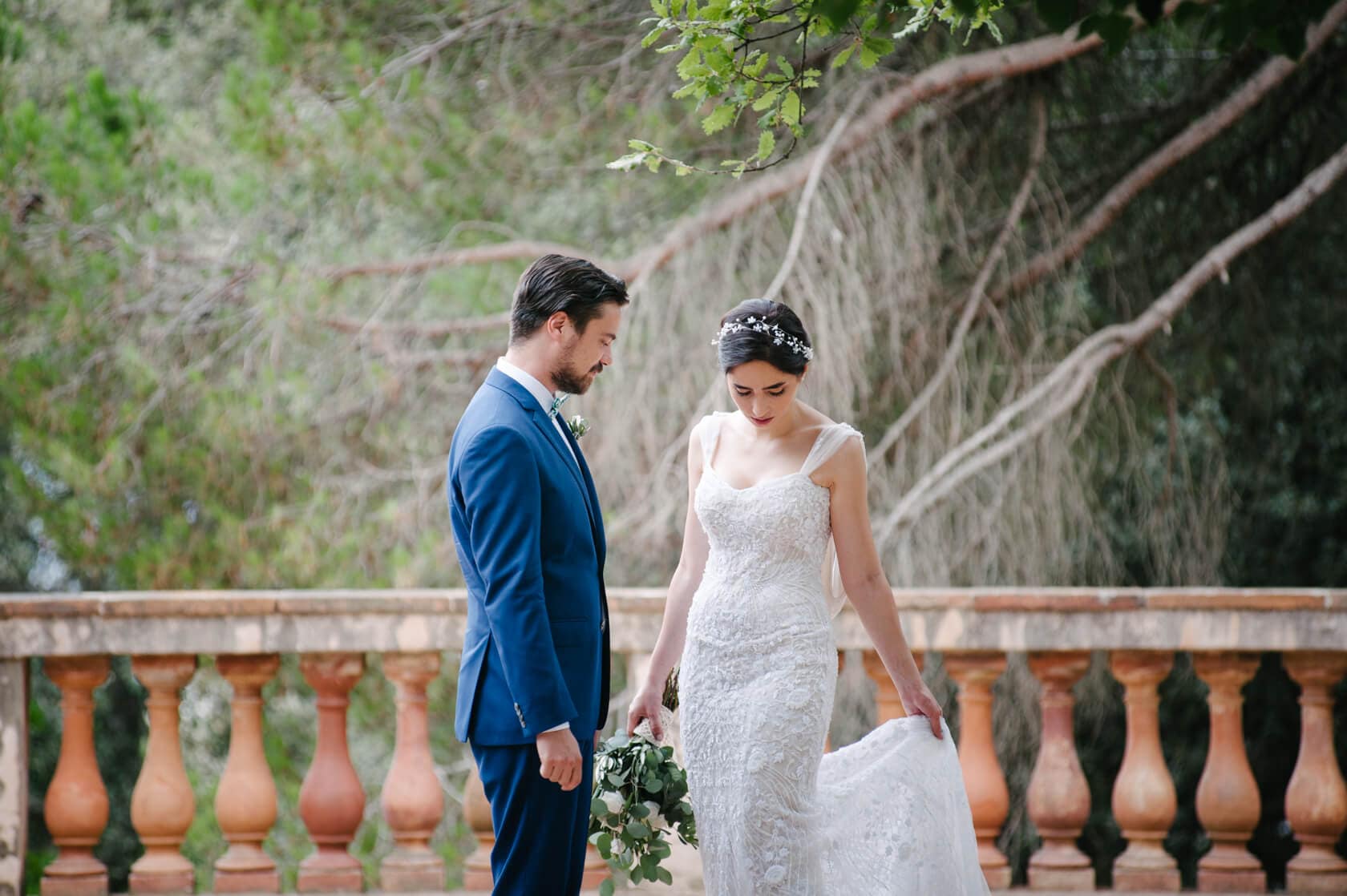Wedding couple at Parc del Laberint d'Horta, bride in beaded dress, groom in blue suit. - Barcelona Wedding Photographer