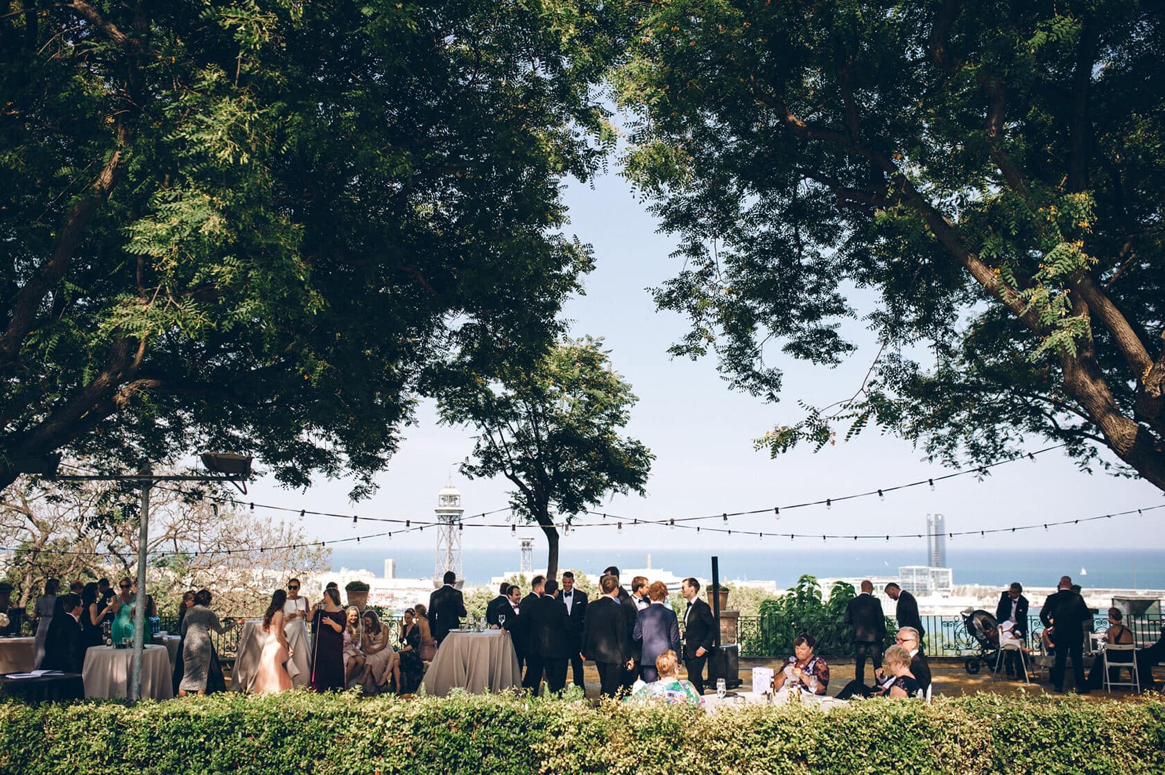 Trine & Torgeir Hotel Miramar Barcelona wedding ceremony outdoors under trees. - Barcelona Wedding Photographer
