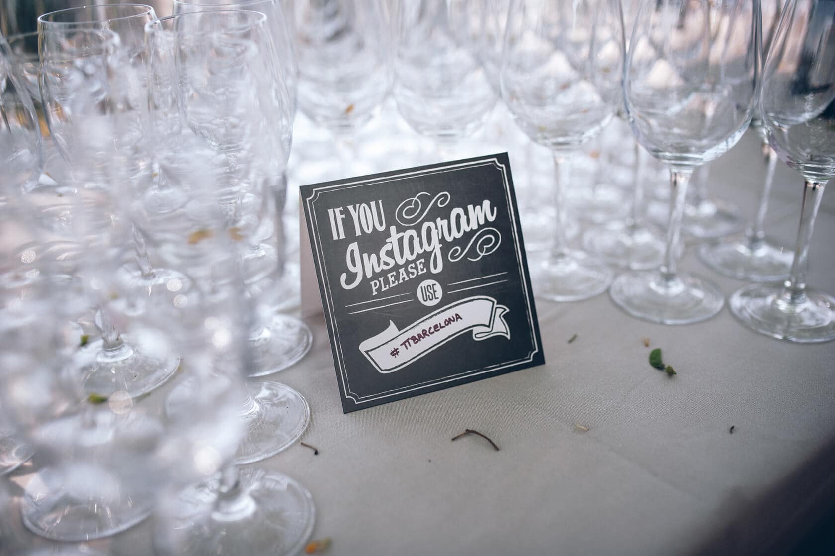 Instagram sign and wine glasses at a Hotel Miramar Barcelona wedding - Barcelona Wedding Photographer