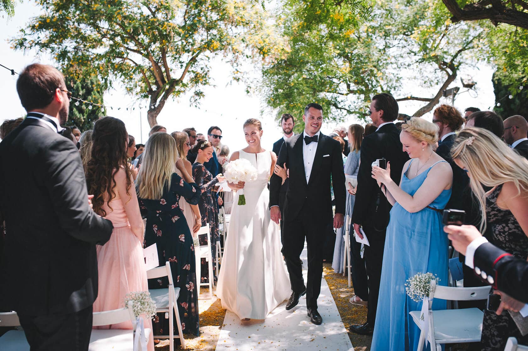 Trine & Torgeir wedding at Hotel Miramar Barcelona: Bride and groom walk down aisle - Barcelona Wedding Photographer