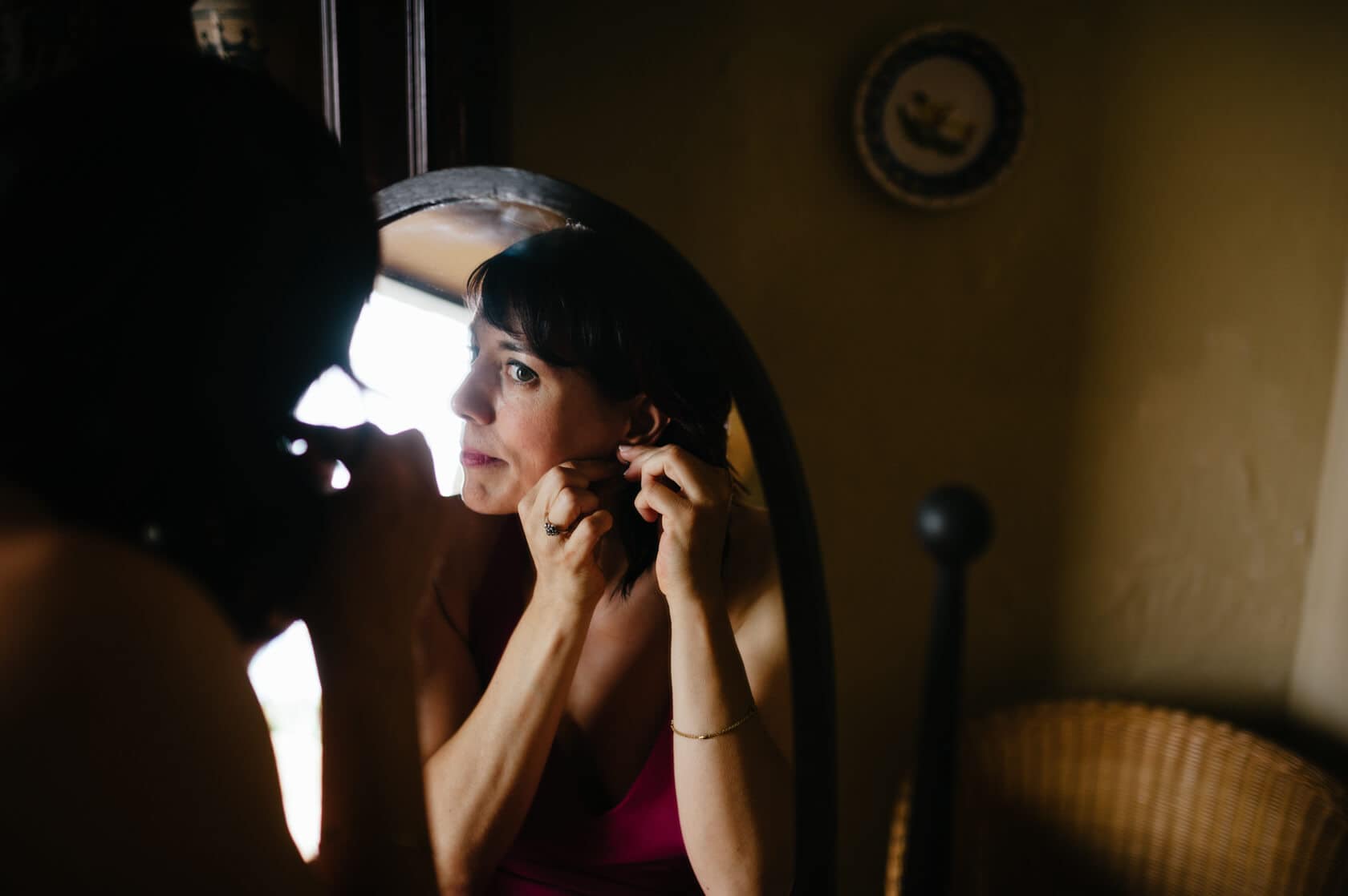 Bride putting on earrings for wedding at Castell de Tamarit - Barcelona Wedding Photographer
