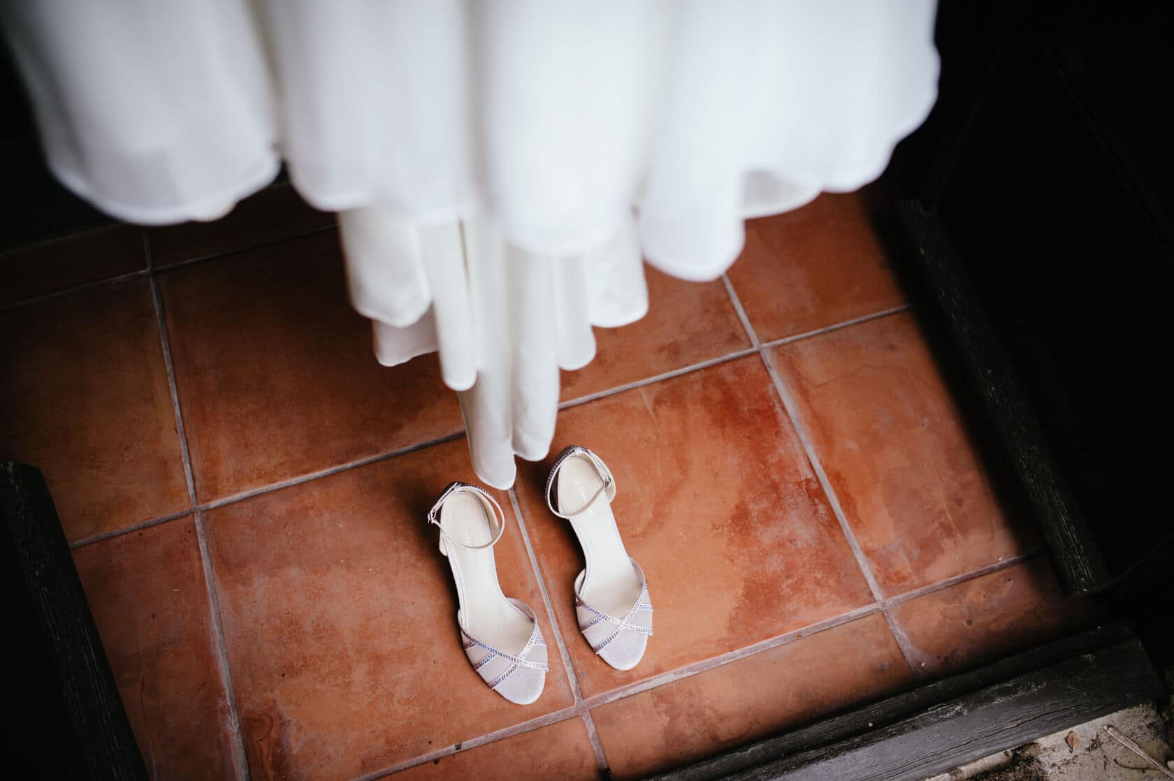 Wedding shoes and dress detail at Castell de Tamarit wedding - Barcelona Wedding Photographer