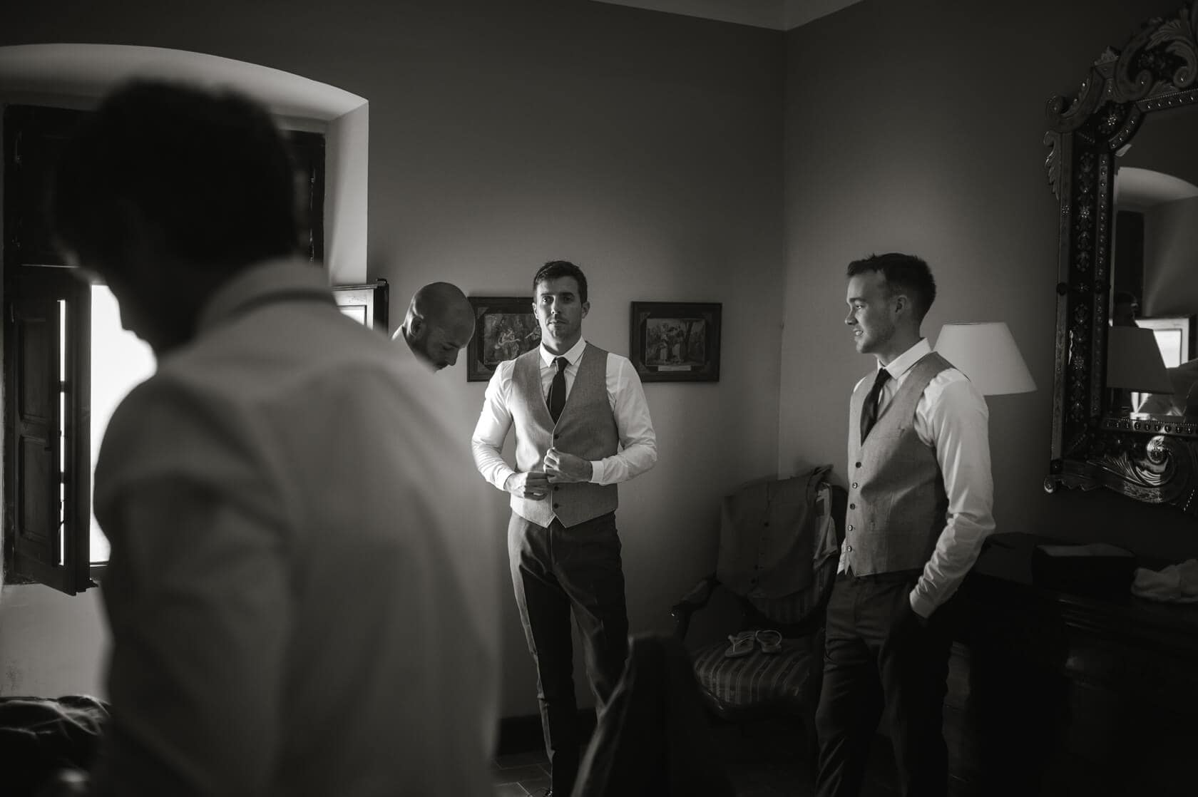 Groom and groomsmen getting ready for a wedding at Castell de Tamarit - Barcelona Wedding Photographer