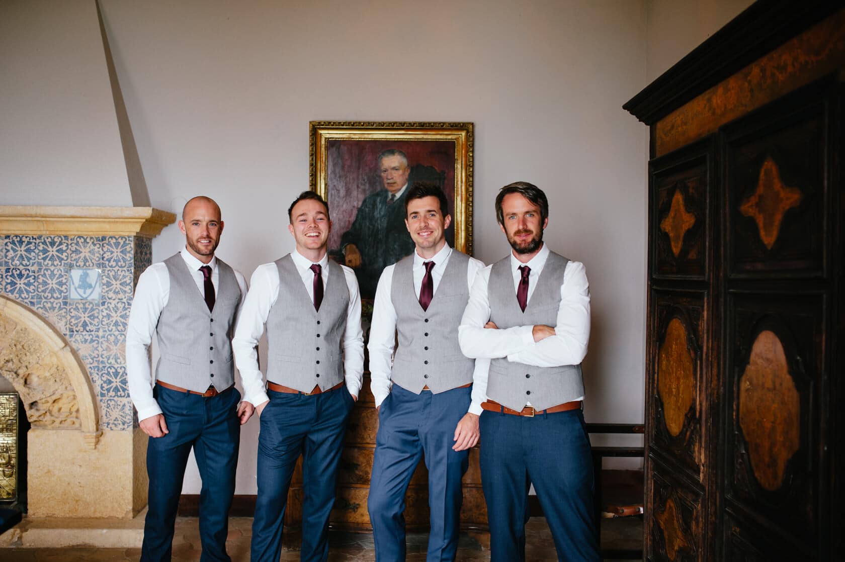 Groomsmen in grey vests and blue suits at Castell de Tamarit wedding. - Barcelona Wedding Photographer