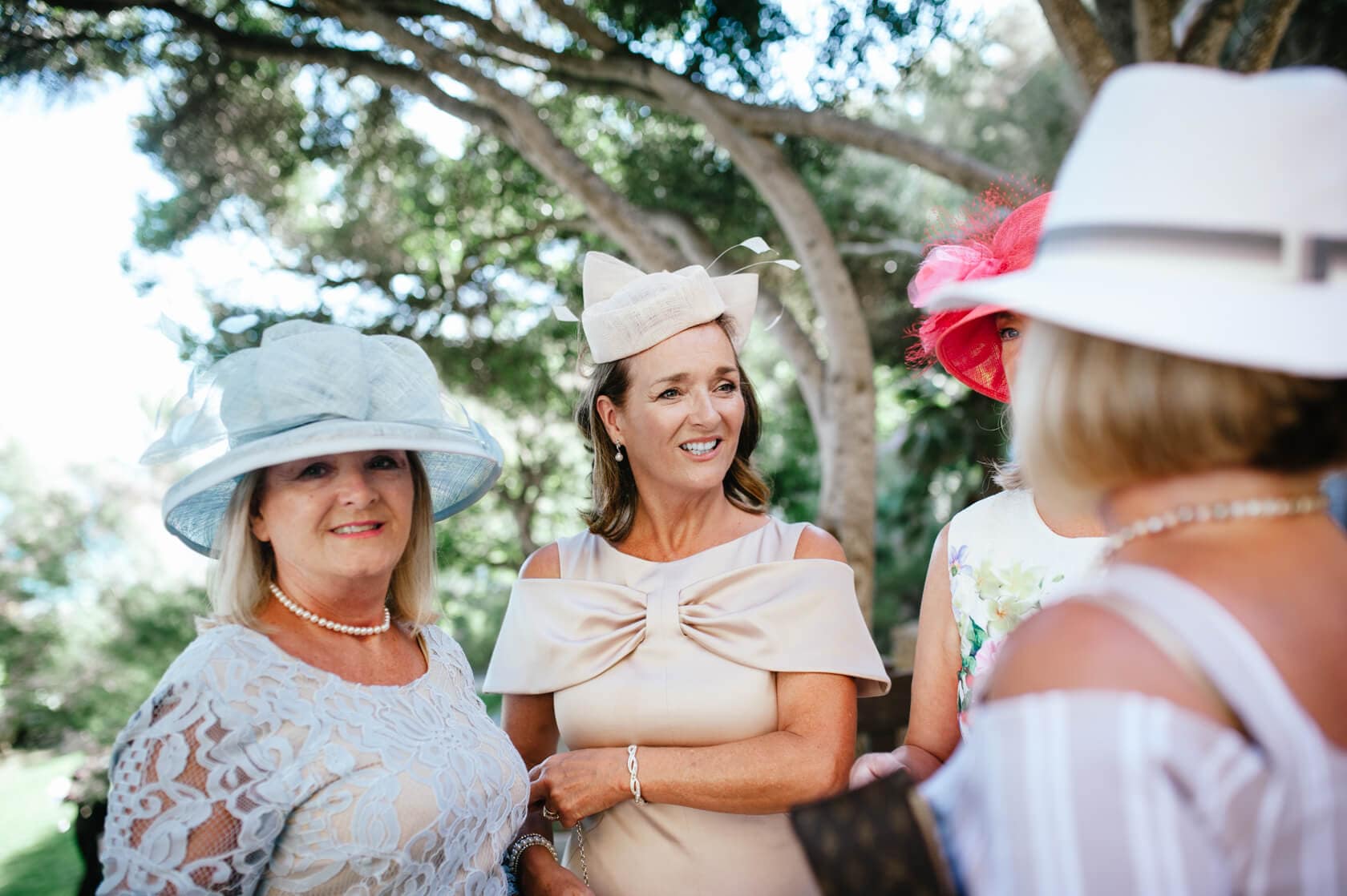 Women in hats at a Sitges wedding at Castell de Tamarit - Barcelona Wedding Photographer