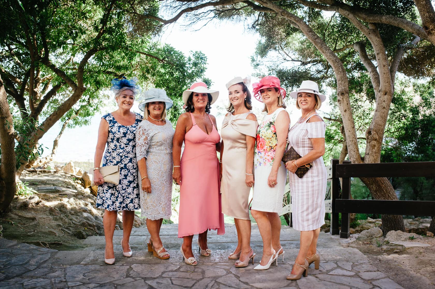Wedding guests in hats at a Sitges wedding, Castell de Tamarit - Barcelona Wedding Photographer
