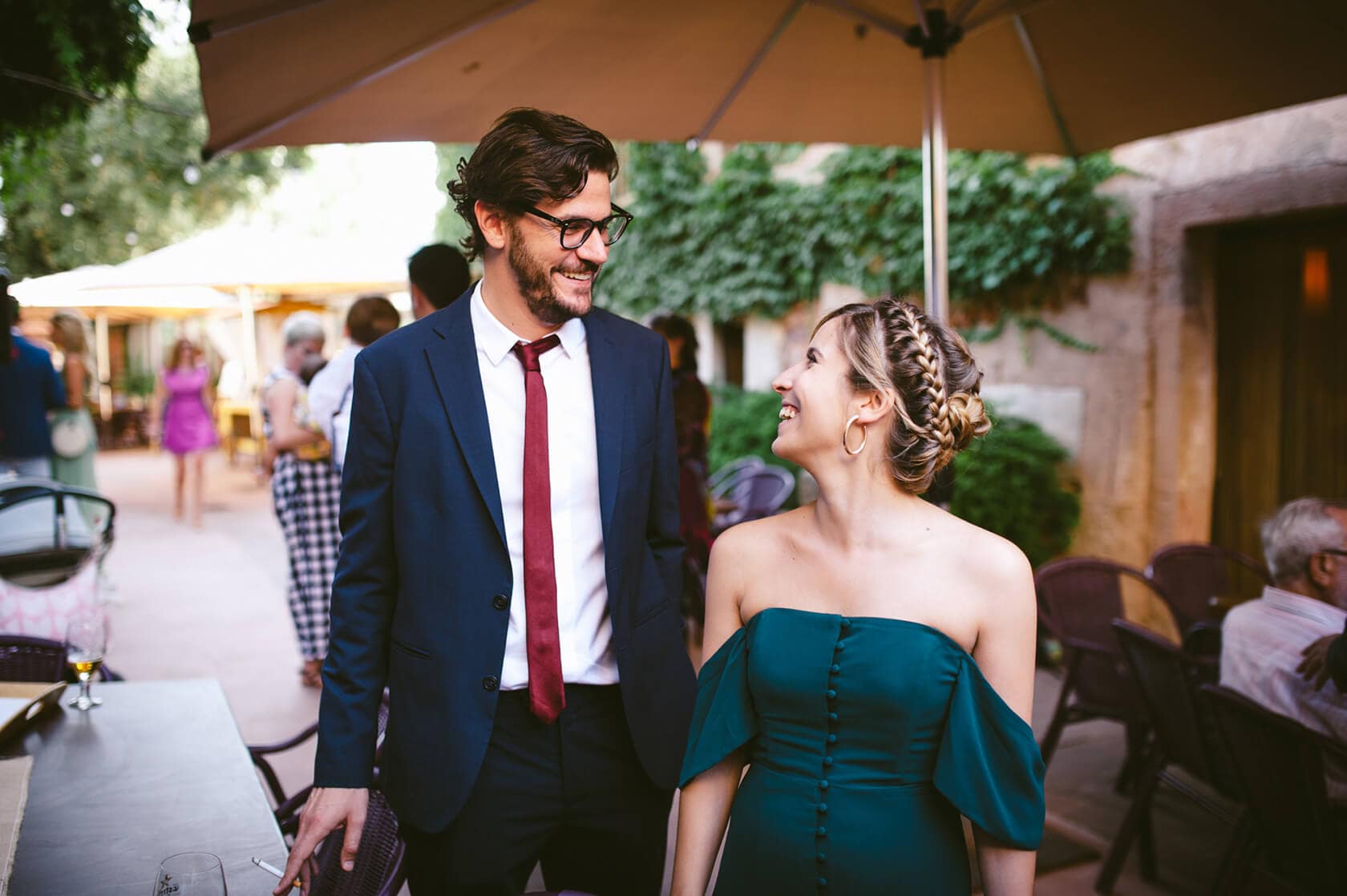 Couple in vintage style wedding attire smiling at each other outdoors. - Barcelona Wedding Photographer