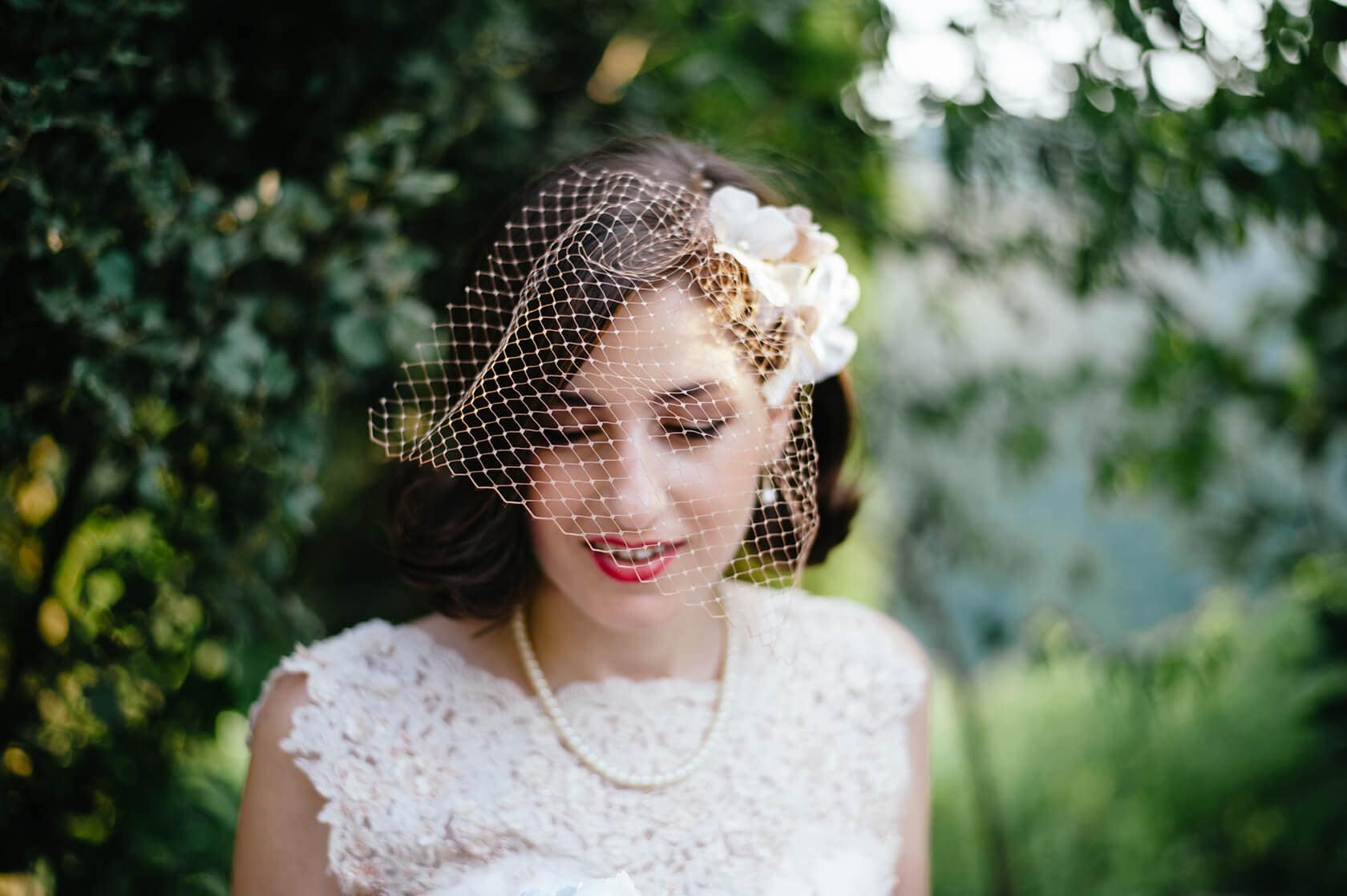 Bride in vintage style wedding attire with veil and flower - Barcelona Wedding Photographer