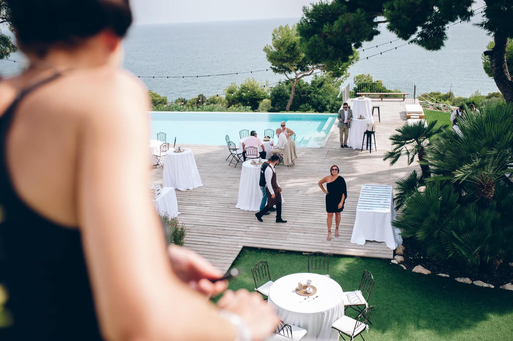 Hayley and Mark, a bride and groom, walk hand-in-hand at their wedding. - Barcelona Wedding Photographer