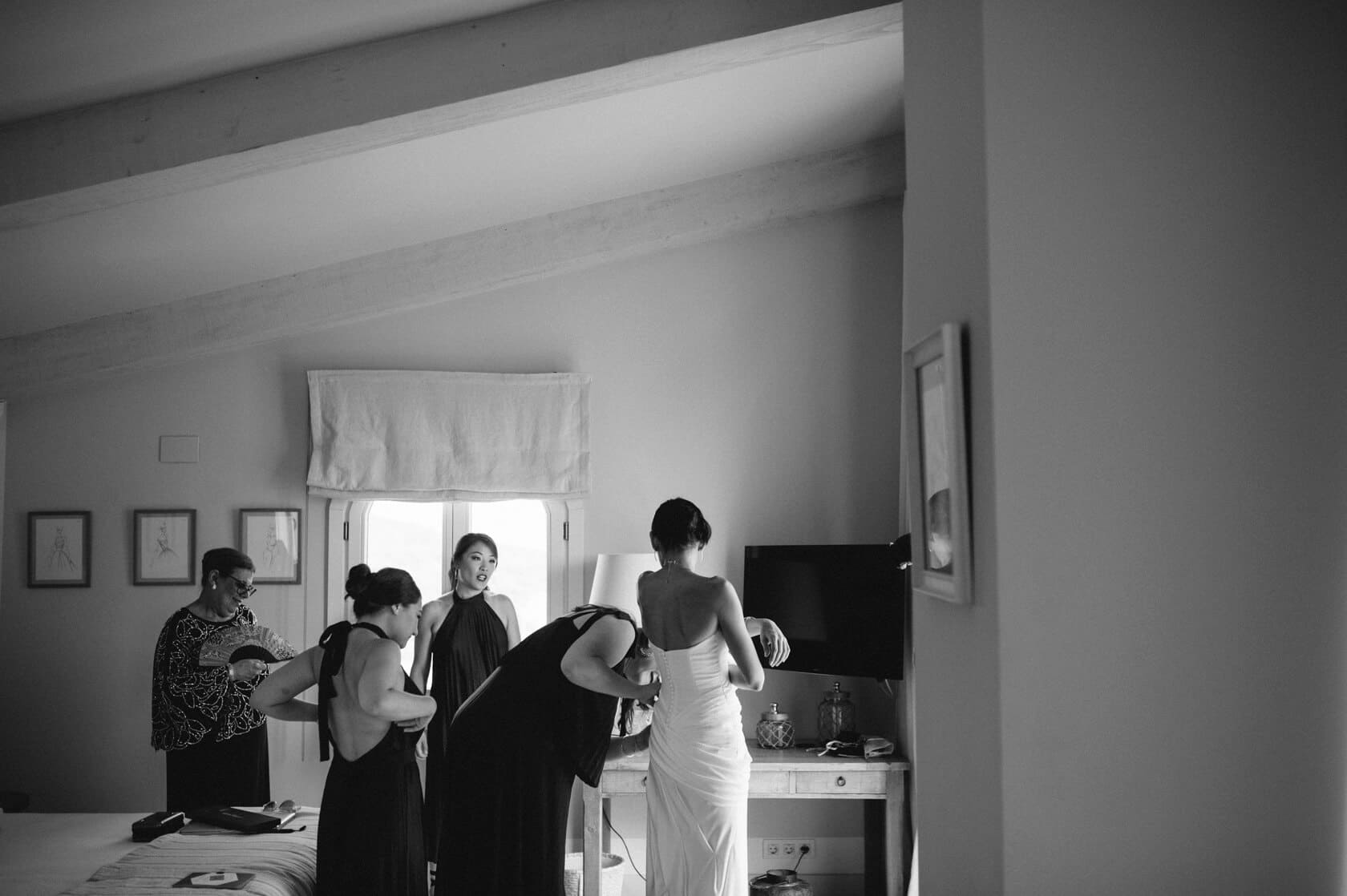 Hayley and Mark, a bride and groom, walk hand-in-hand at their wedding. - Barcelona Wedding Photographer