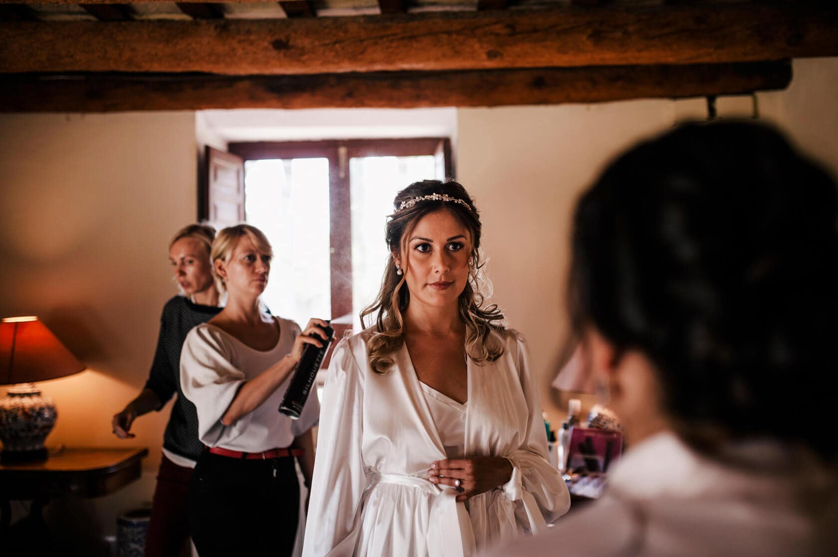 Hayley and Mark, a bride and groom, walk hand-in-hand at their wedding. - Barcelona Wedding Photographer