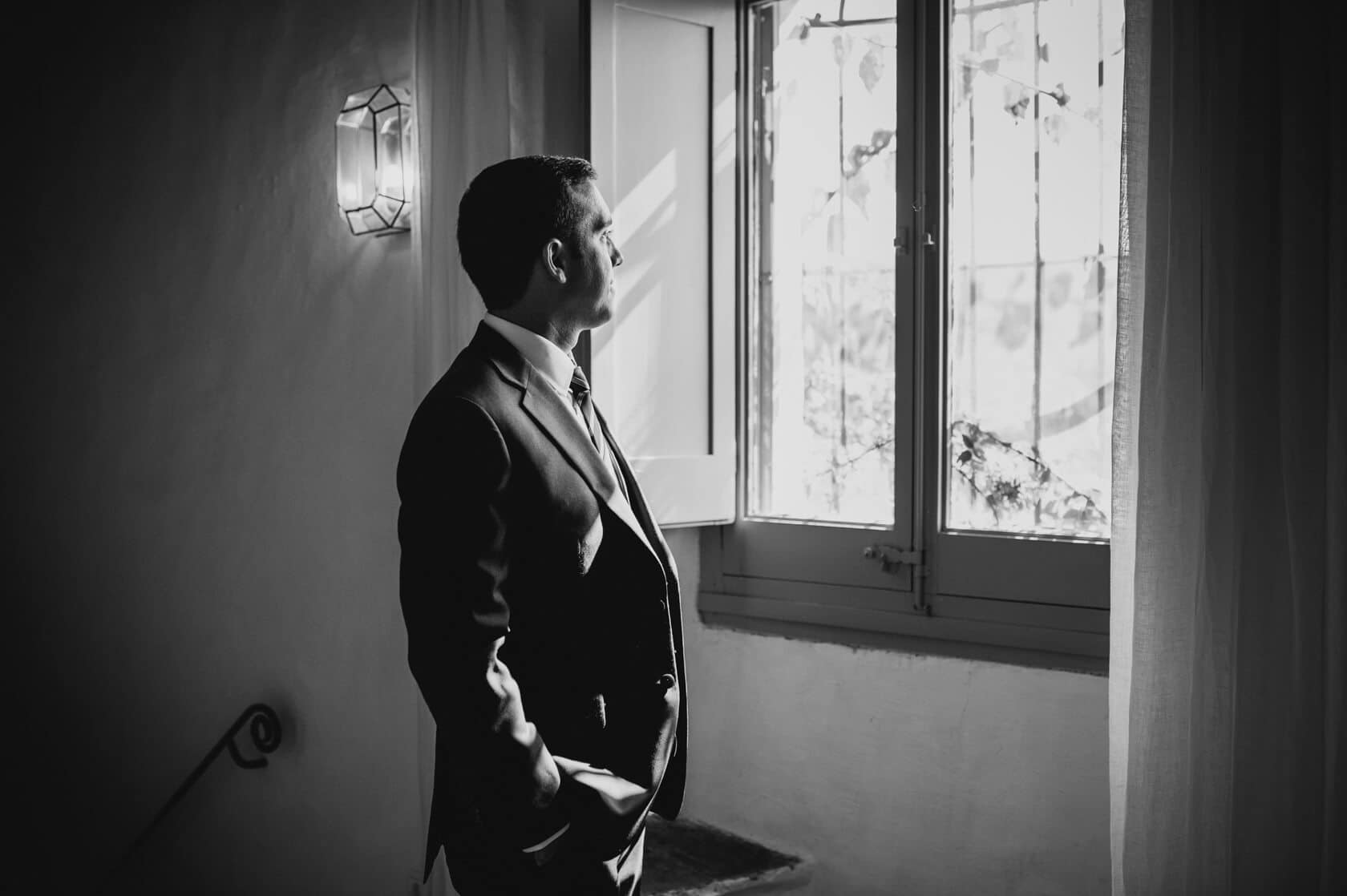 Hayley and Mark, a bride and groom, walk hand-in-hand at their wedding. - Barcelona Wedding Photographer