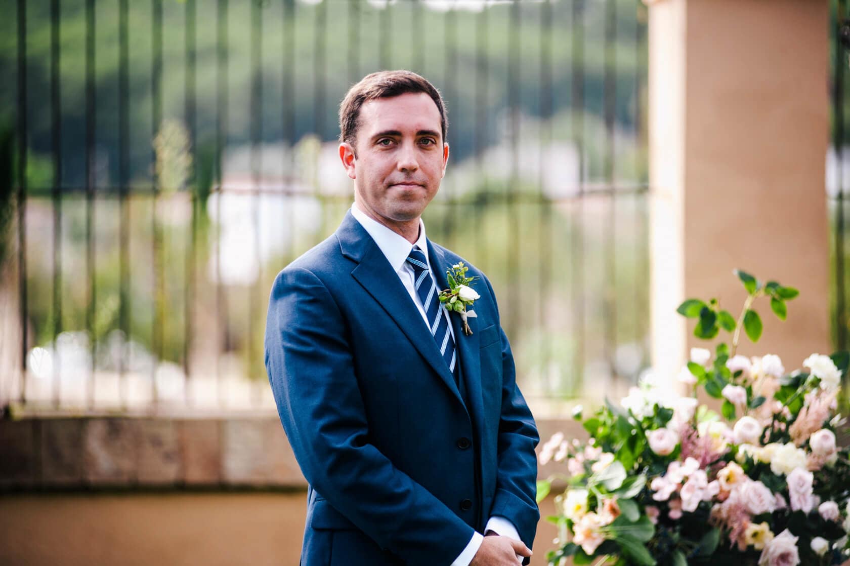 Hayley and Mark, a bride and groom, walk hand-in-hand at their wedding. - Barcelona Wedding Photographer