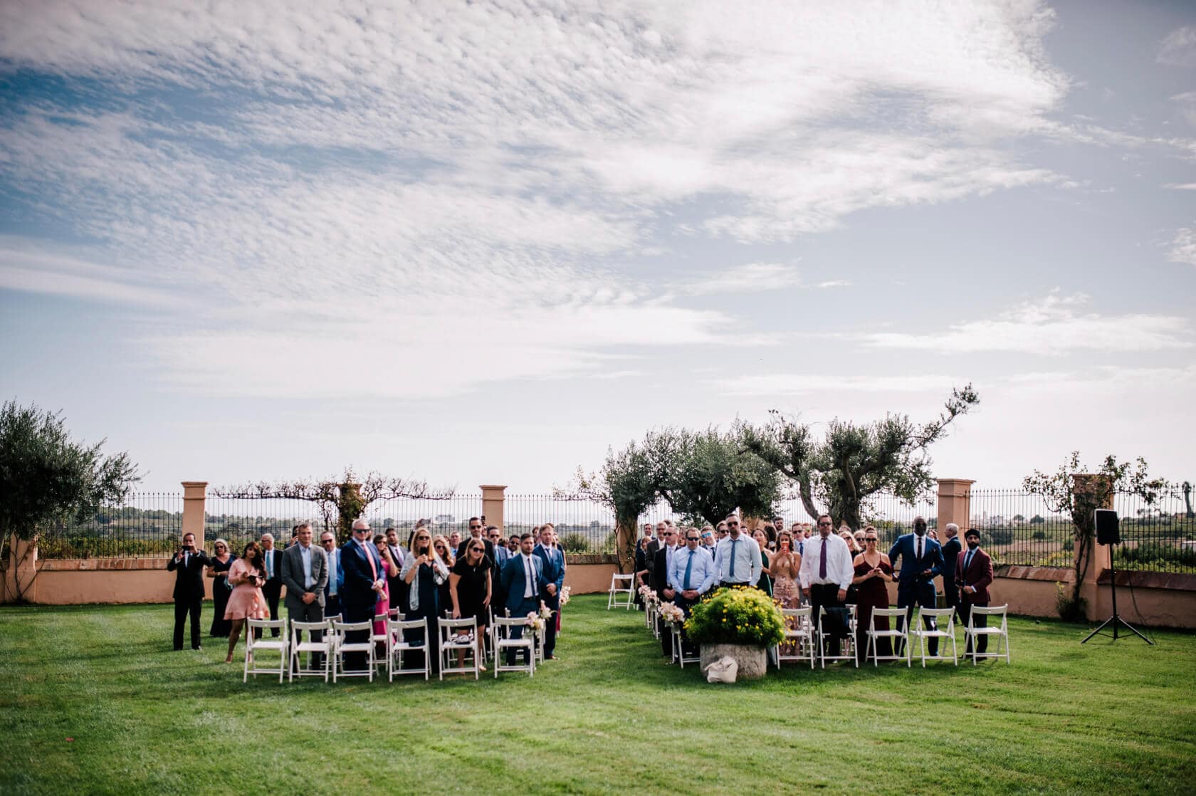 Hayley and Mark, a bride and groom, walk hand-in-hand at their wedding. - Barcelona Wedding Photographer