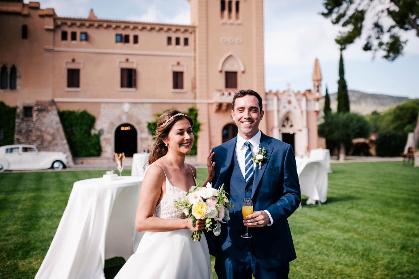 Hayley and Mark, a bride and groom, walk hand-in-hand at their wedding. - Barcelona Wedding Photographer