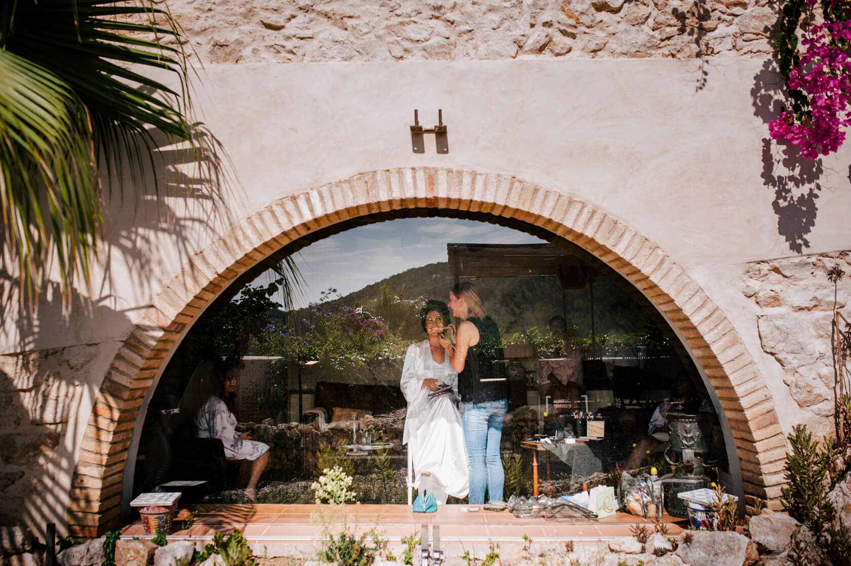 Hayley and Mark, a bride and groom, walk hand-in-hand at their wedding. - Barcelona Wedding Photographer