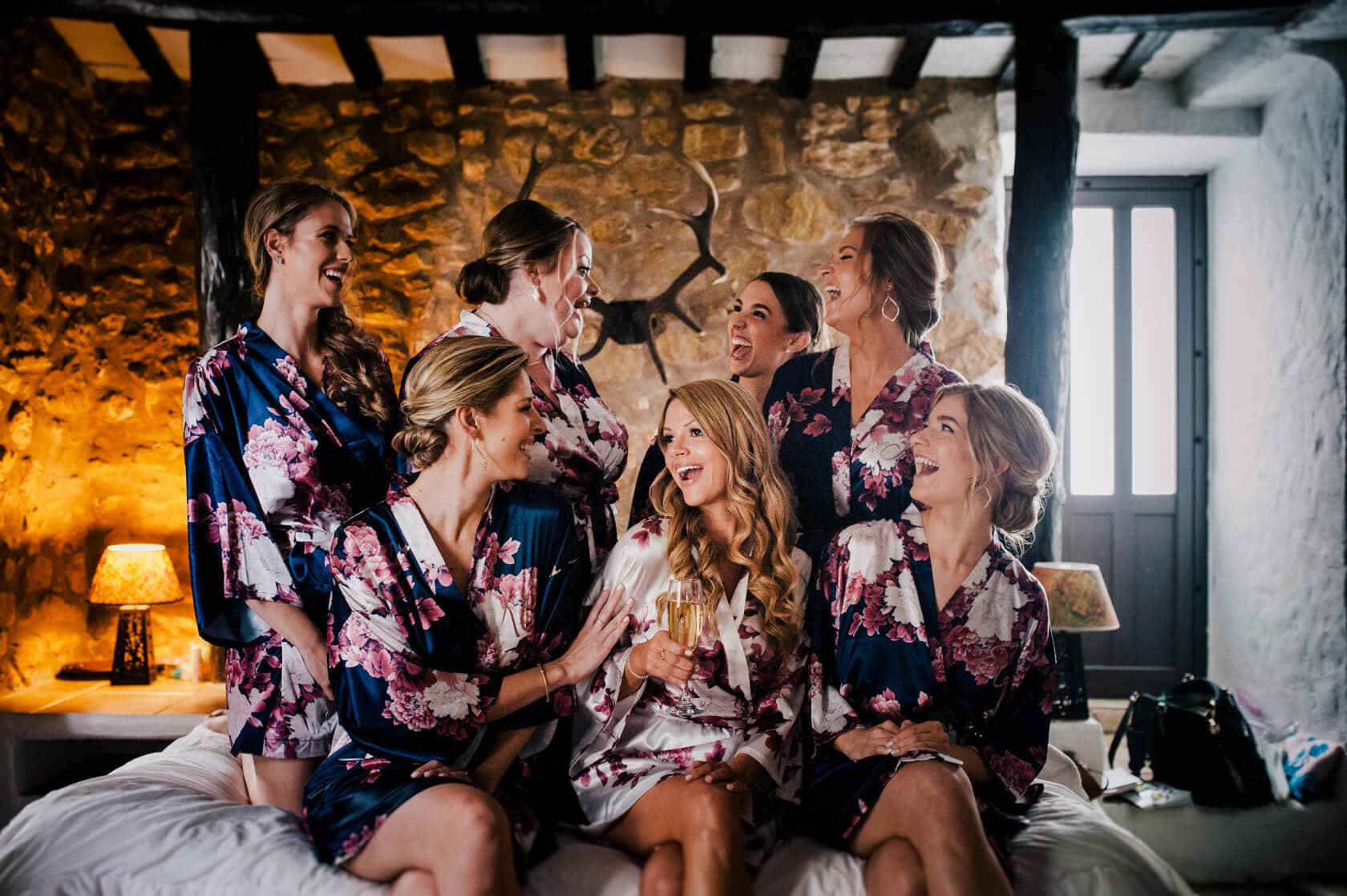 Hayley and Mark, a bride and groom, walk hand-in-hand at their wedding. - Barcelona Wedding Photographer