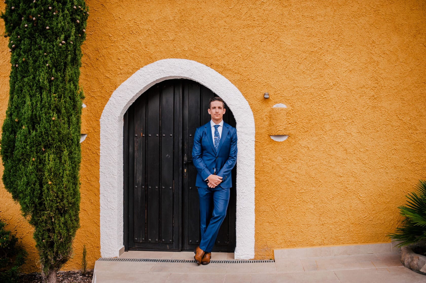 Hayley and Mark, a bride and groom, walk hand-in-hand at their wedding. - Barcelona Wedding Photographer
