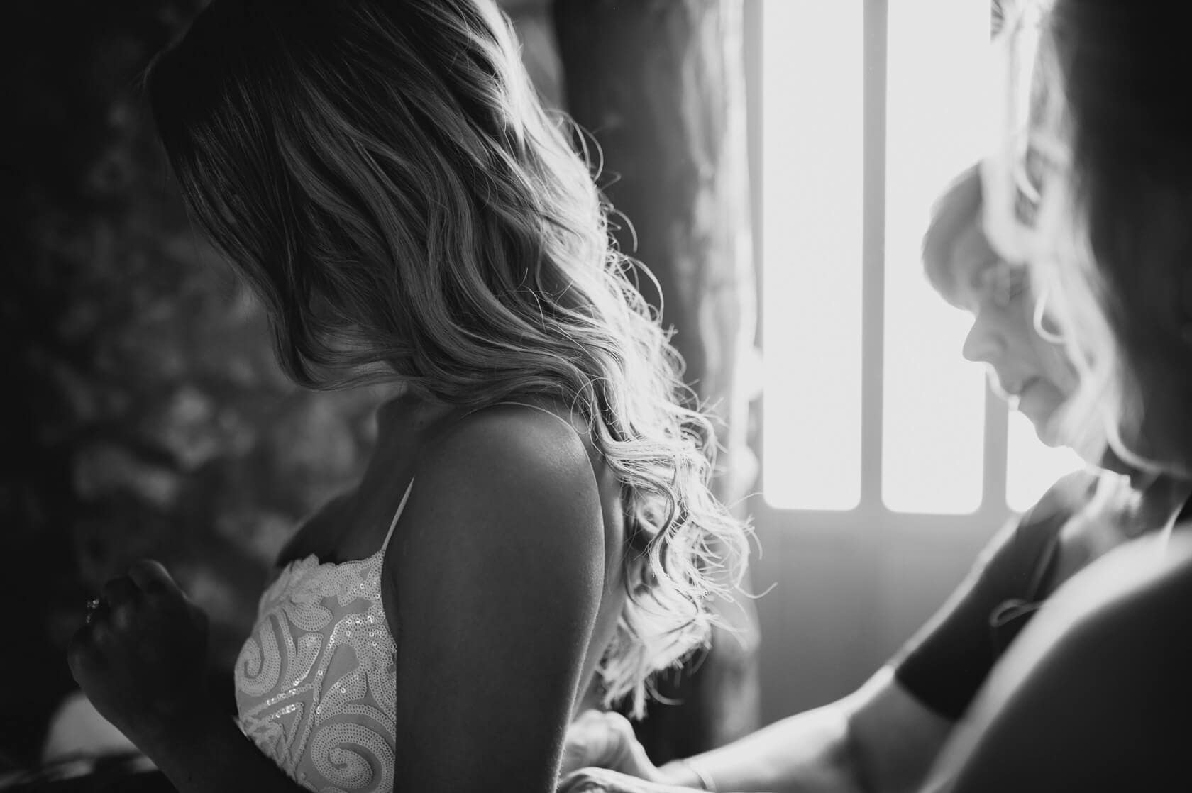 Hayley and Mark, a bride and groom, walk hand-in-hand at their wedding. - Barcelona Wedding Photographer