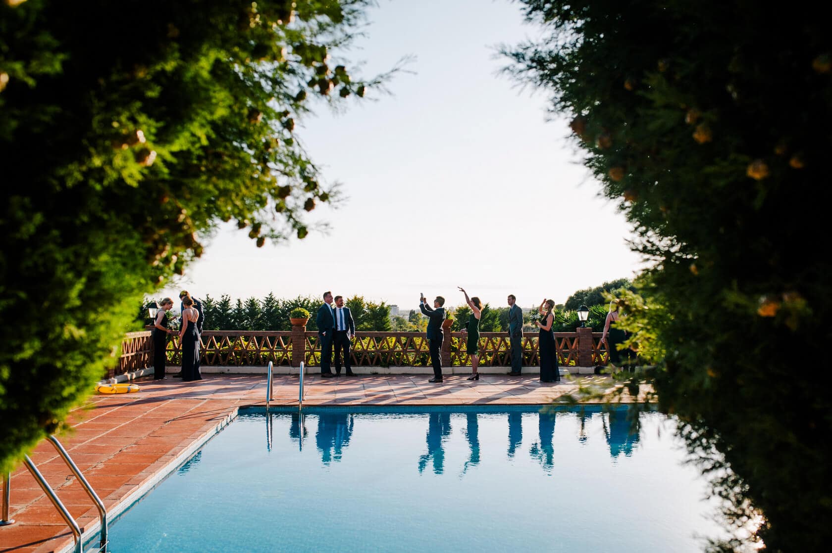 Hayley and Mark, a bride and groom, walk hand-in-hand at their wedding. - Barcelona Wedding Photographer