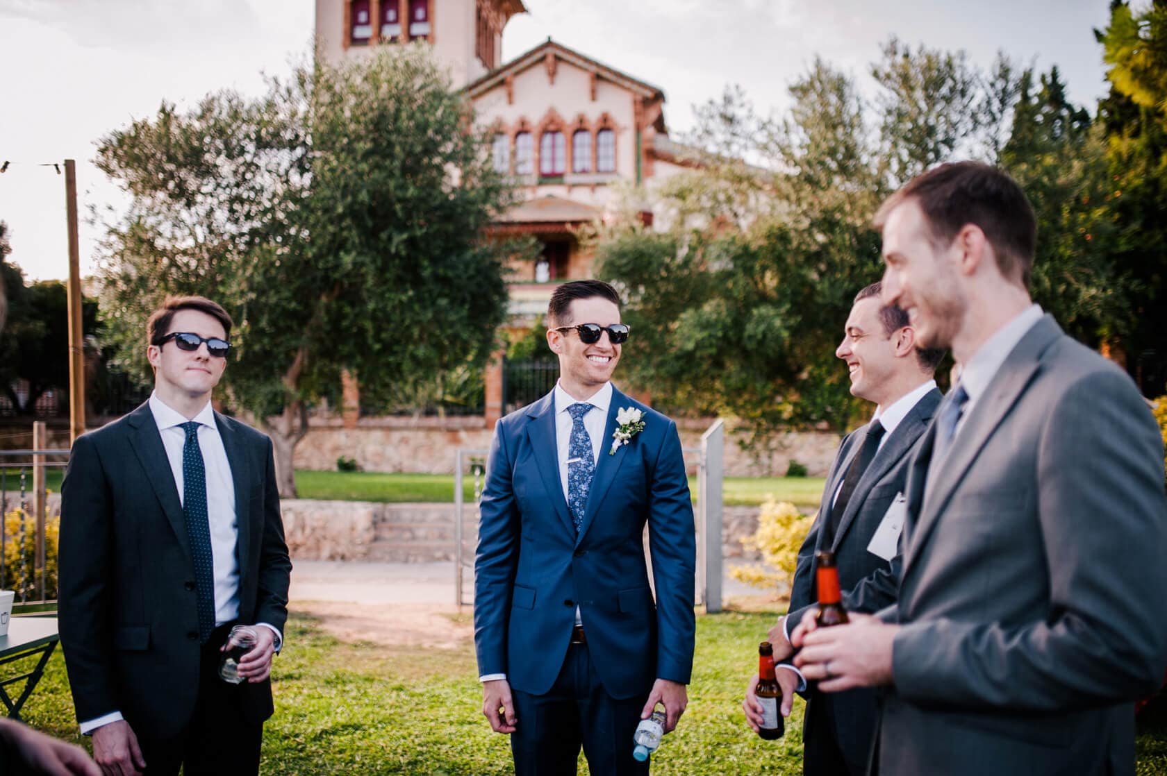 Hayley and Mark, a bride and groom, walk hand-in-hand at their wedding. - Barcelona Wedding Photographer