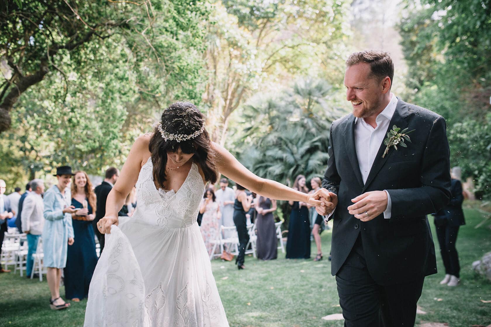 Bride and groom exit Villa Almanita wedding in Sitges - Barcelona Wedding Photographer