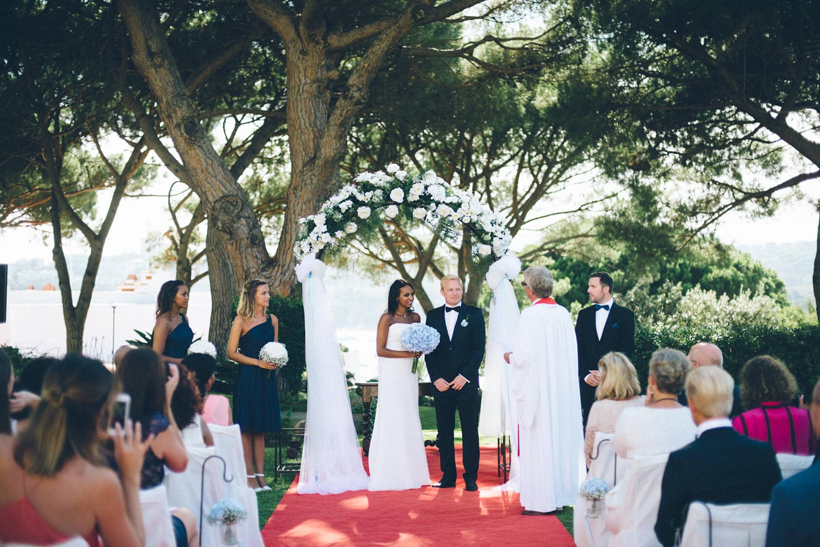 Wedding photographer captures Tsega and Anders exchanging vows in S'Agaro, Spain. - Barcelona Wedding Photographer