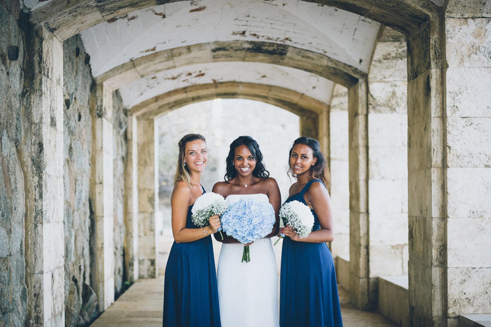Bride and bridesmaids with bouquets at a wedding in S'Agaro, Spain - Barcelona Wedding Photographer