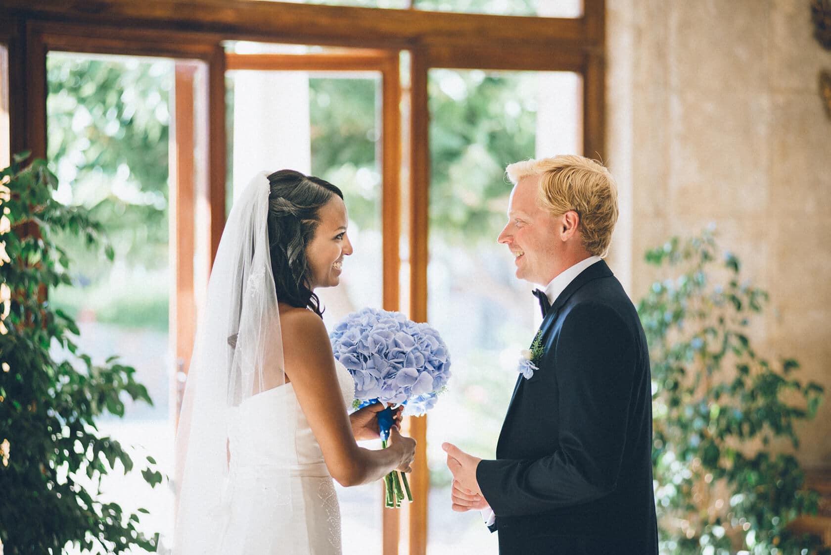 Bride and groom smiling at each other during a wedding in S'Agaro, Spain. - Barcelona Wedding Photographer
